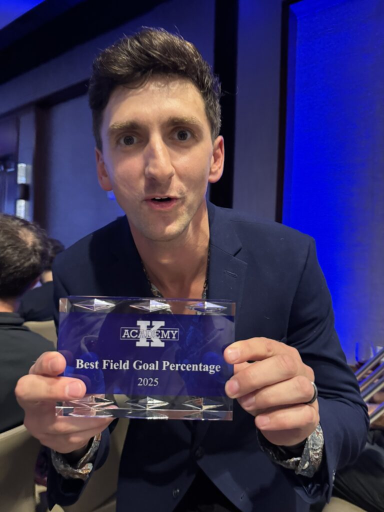 Dan Lerman holds his K Academy 'Best Field Goal Percentage 2025' award.